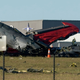 A photo of the aftermath of a mid-air collision between two vintage planes.